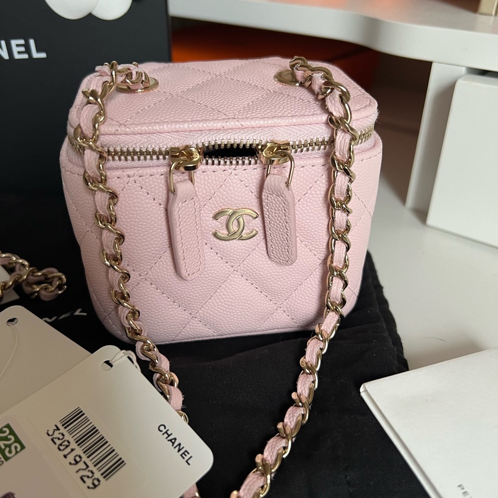 CHANEL
Light Pink Quilted Caviar Leather Mini Vanity Case With Chain Bag